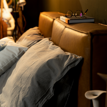 Load image into Gallery viewer, The Emery bedframe features a cushioned headboard, the flat surface can serve as a shelf for small items like phones, glasses and more. Additionally, the platform structure facilitates simple sheet-changing without having to lift the mattress - a feature your back is sure to appreciate. Choice of leather available.