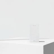 White notepad with a visible brand logo on a white background