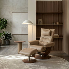Load image into Gallery viewer, Modern living room with a brown armchair, ottoman, and bookshelves.
