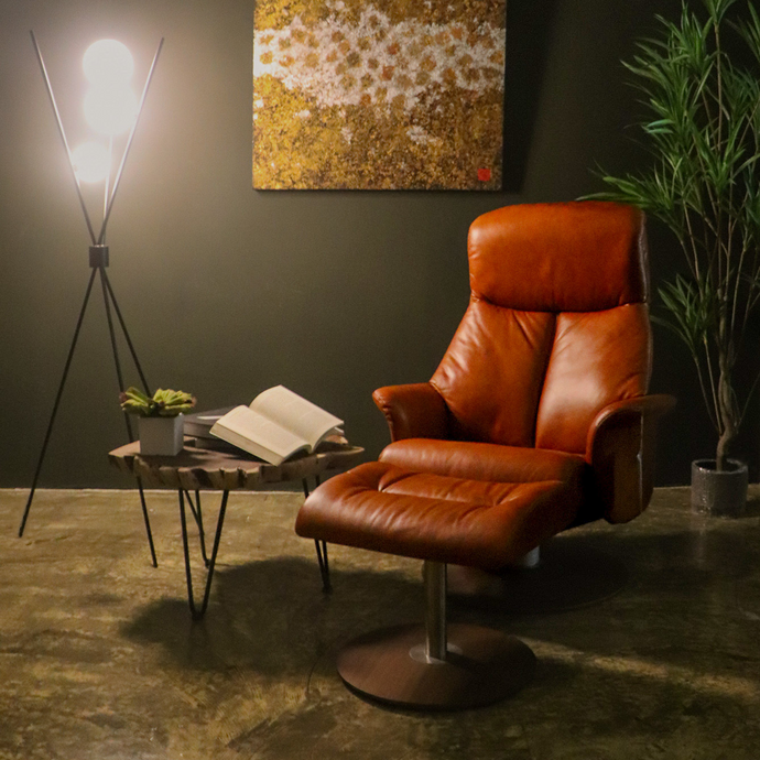 Leone recliner lounge chair emphasizes ergonomic comfort and environmental sustainability, providing visual and physical comfort for office, hospitality, and residential contexts. The butter-soft bovine leather upholstery envelops the user in comfort and a matching footrest offers full repose and relaxation.